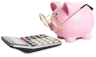 piggy bank and calculator for cost of cosmetic dentistry in Wethersfield 