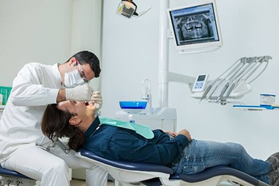 dentist working on a patient’s mouth