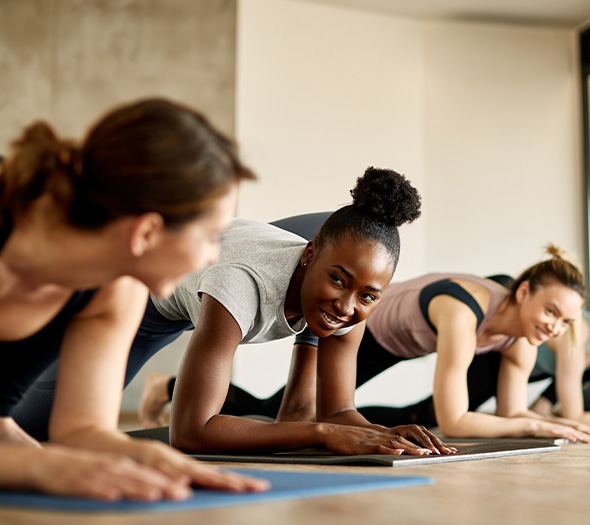 Group of friends smiling while working out together