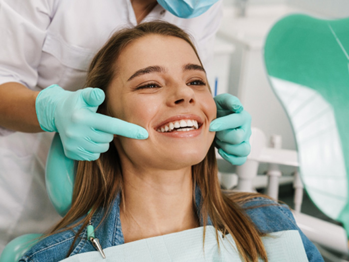 Woman smiling at the dentist