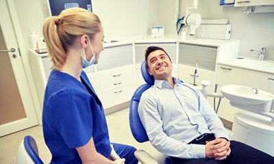man sitting in chair of dentist in Wethersfield 