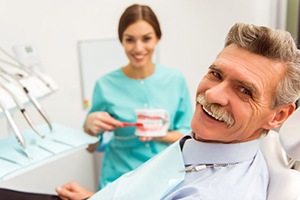 man at a consultation with his denture dentist in Wethersfield 