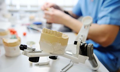 Dental lab creating replacement teeth.