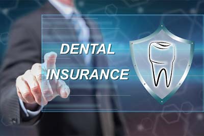 Invisalign dentist in Wethersfield pointing to dental insurance graphic