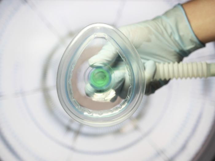 Patient POV of nasal mask being placed