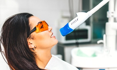 person getting their teeth professionally whitened 