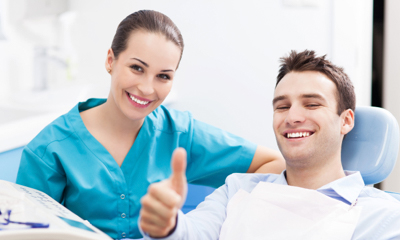 Smiling patient in dentist chair
