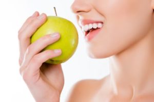 Woman eating an apple