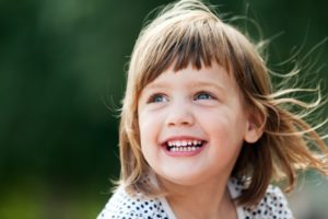 Young girl smiling.