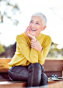 mature woman smiling outdoors