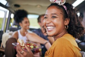 Woman smiling while eating food