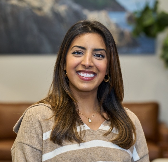 Young brunette woman grinning with flawless teeth